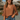 woman wearing a brown blouse and brown hat and jean shorts. La dolce fiona